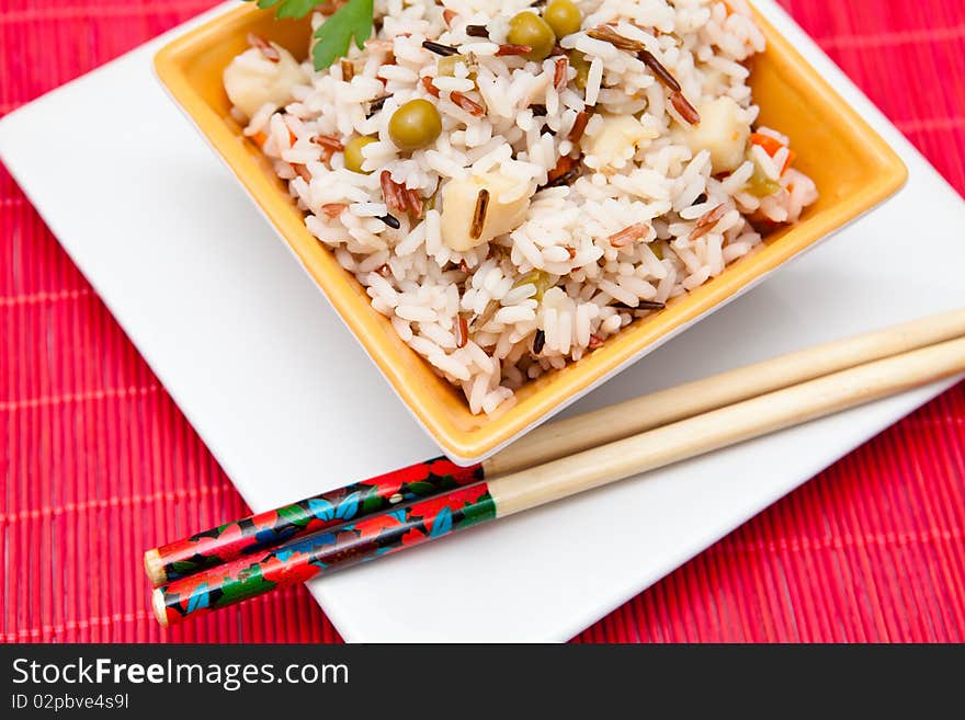 Asian rice salad on a bowl with vegetables