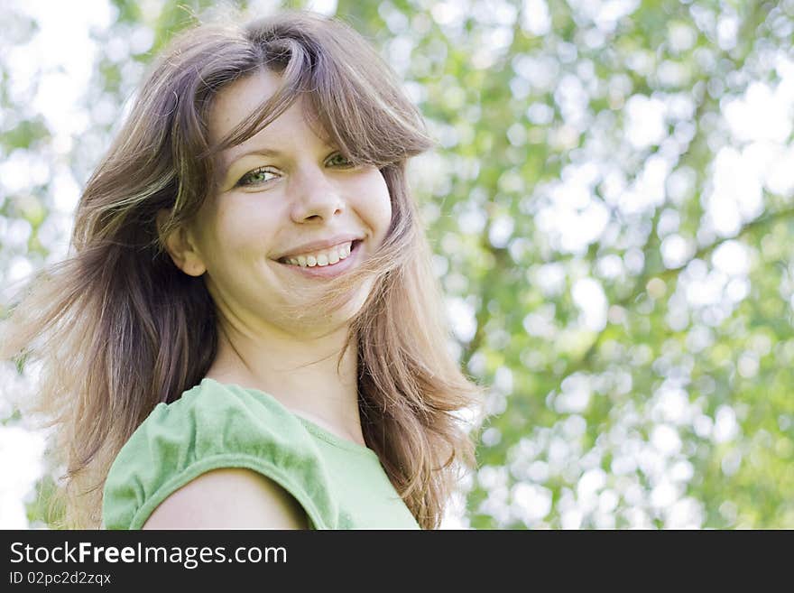 Closeup portrait of a friendly young woman enjoying the wind. Closeup portrait of a friendly young woman enjoying the wind