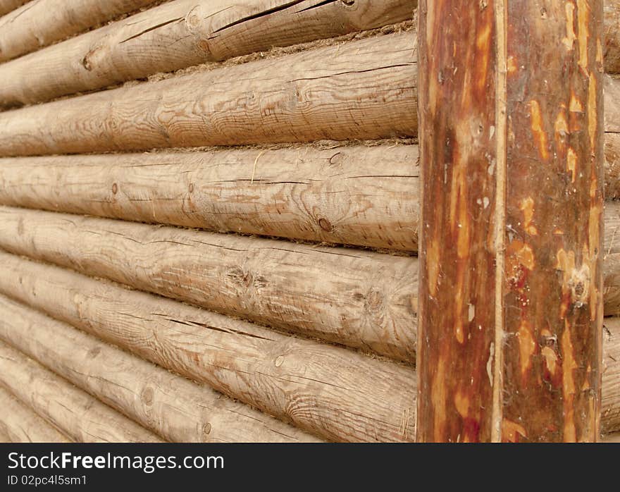 Fragment of a wall of a old wooden house. Fragment of a wall of a old wooden house