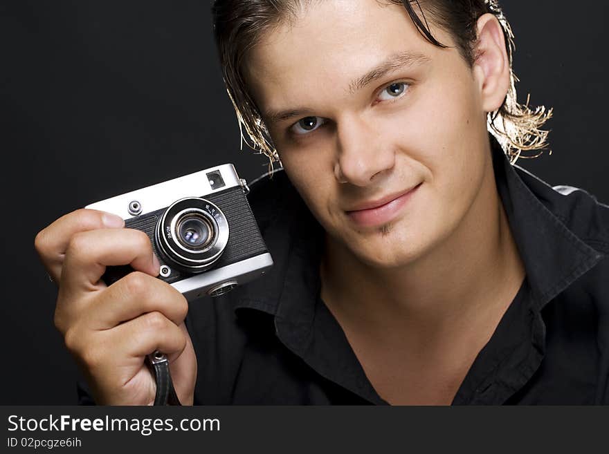 Man holding a photo camera. Man holding a photo camera