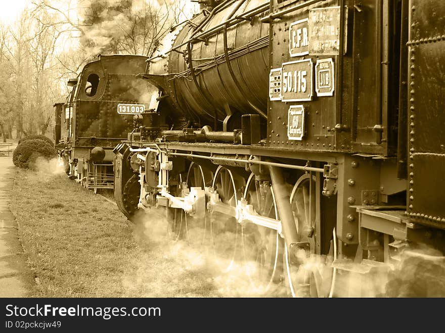 The old - fashioned steam locomotive speeding. The old - fashioned steam locomotive speeding