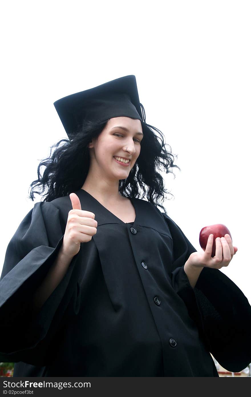 Young laughing student in gown with okay