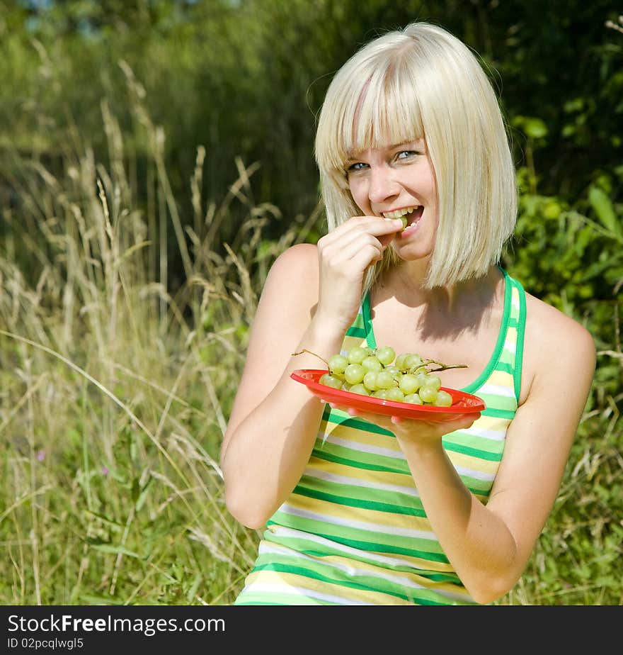 Portrait of woman with grape