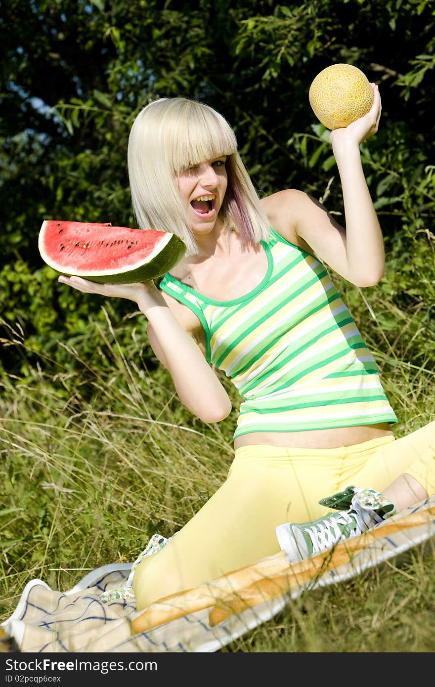 Woman with melons at a picnic. Woman with melons at a picnic