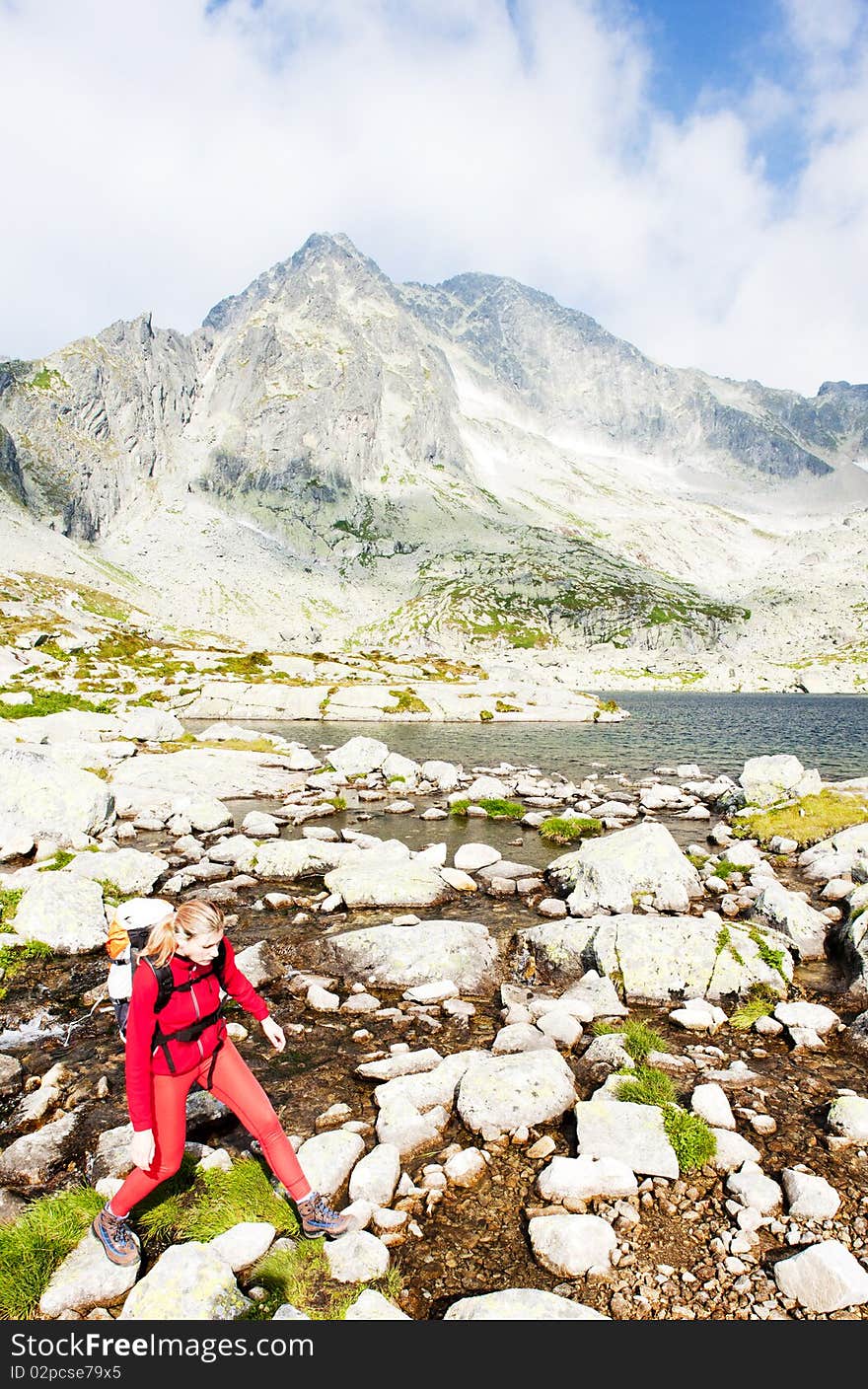 Woman backpacker at Five Spis Tarns, Vysoke Tatry (High Tatras), Slovakia. Woman backpacker at Five Spis Tarns, Vysoke Tatry (High Tatras), Slovakia