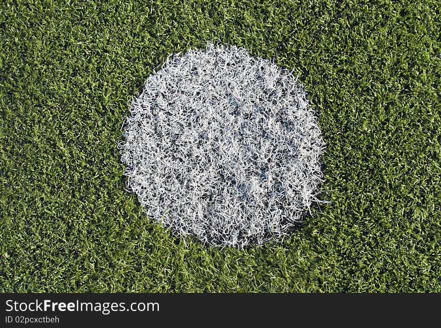 Soccer penalty kick on plastic grass