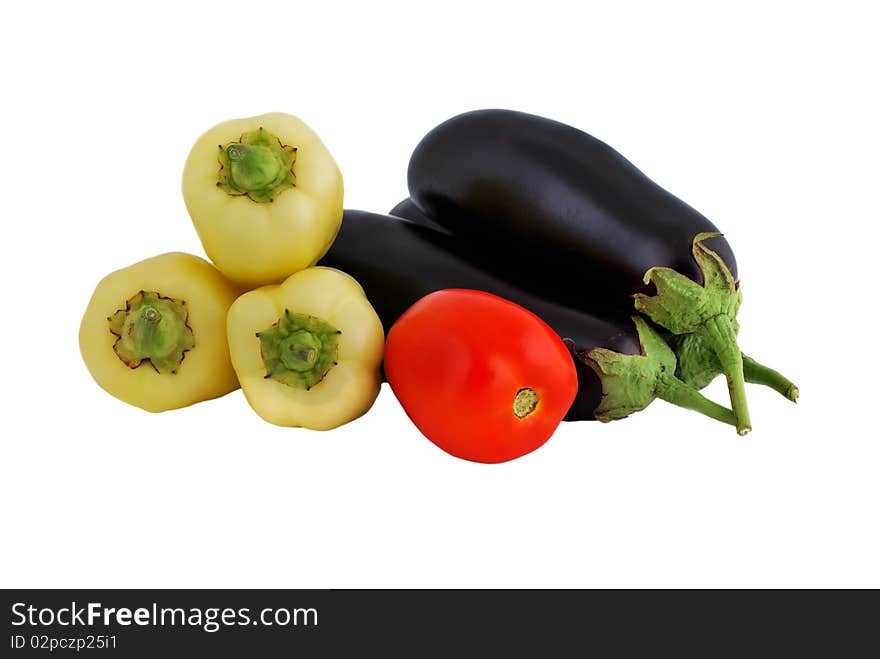 Vegetables: tomatoes, eggplant and peppers on a white background