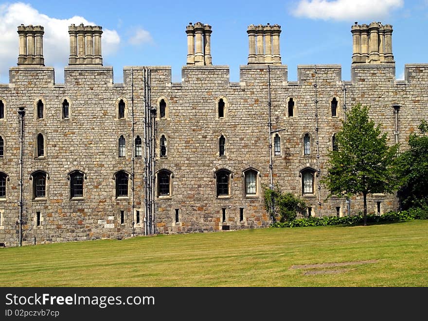 Windsor castle wall and green lawn, England