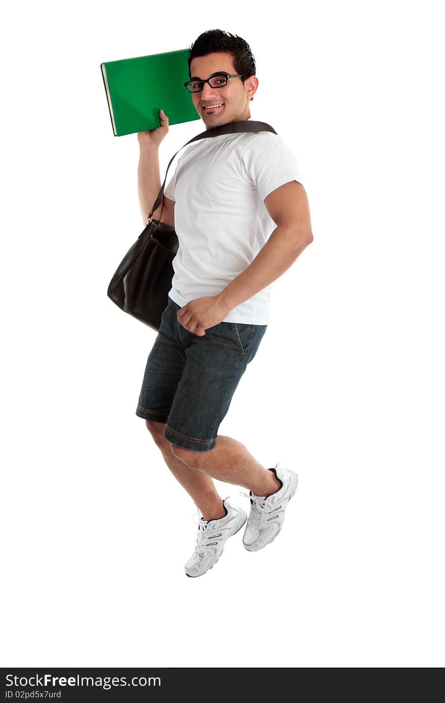 A happy smiling energetic jumping college student holding a book or textbook. White background. A happy smiling energetic jumping college student holding a book or textbook. White background.