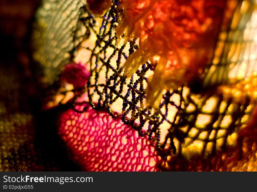 Abstract close-up of the hand made lighter. beads and beads, bright colors,  shallow depth of field.