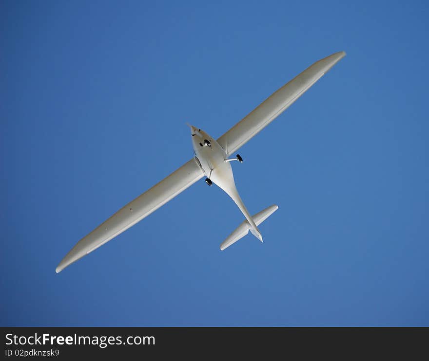 Glider hovering in the blue sky. Glider hovering in the blue sky