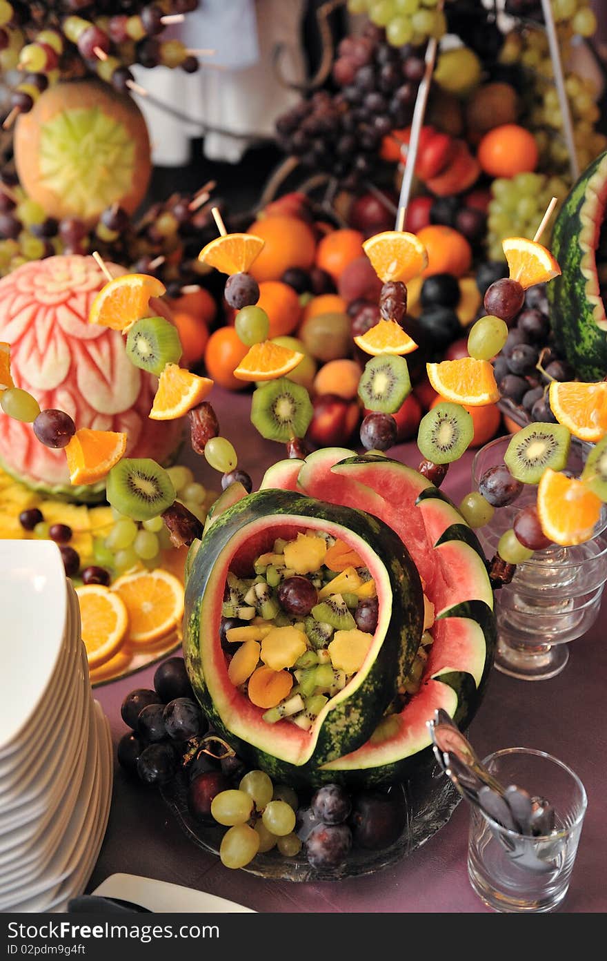 Fruit plate with bananas,kiwis, pineapples, apples, grapes