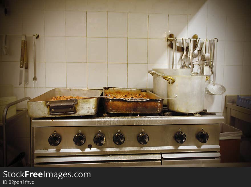 Pots lying on a restaurant kitchen. Pots lying on a restaurant kitchen