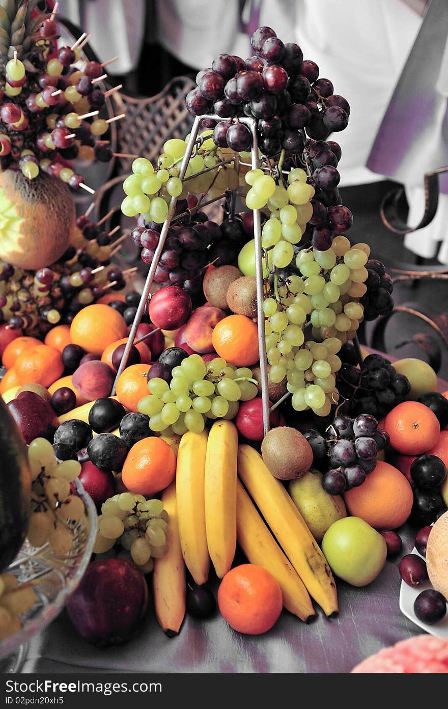 Fruit plate with bananas,kiwis, pineapples, apples, grapes