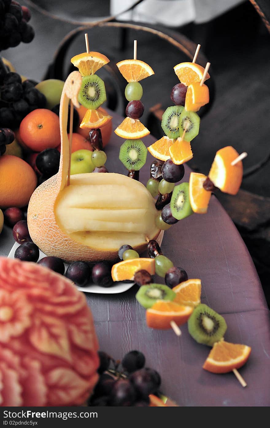 Fruit plate with bananas,kiwis, pineapples, apples, grapes