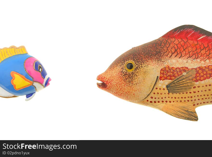 Two model fish face each other isolated against white