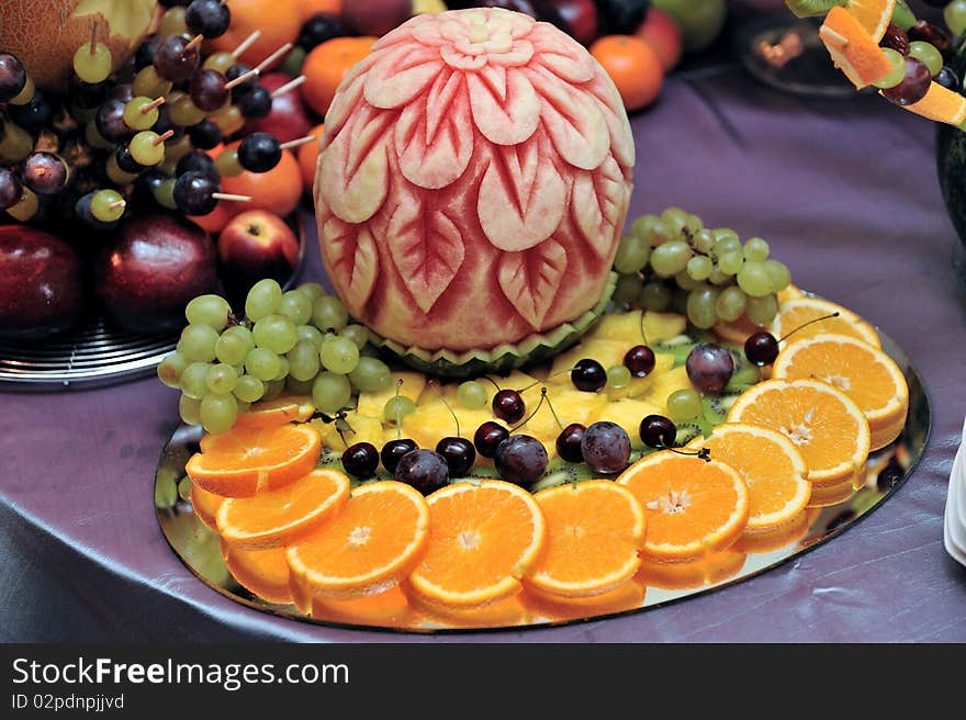 Fruit plate with bananas,kiwis, pineapples, apples, grapes