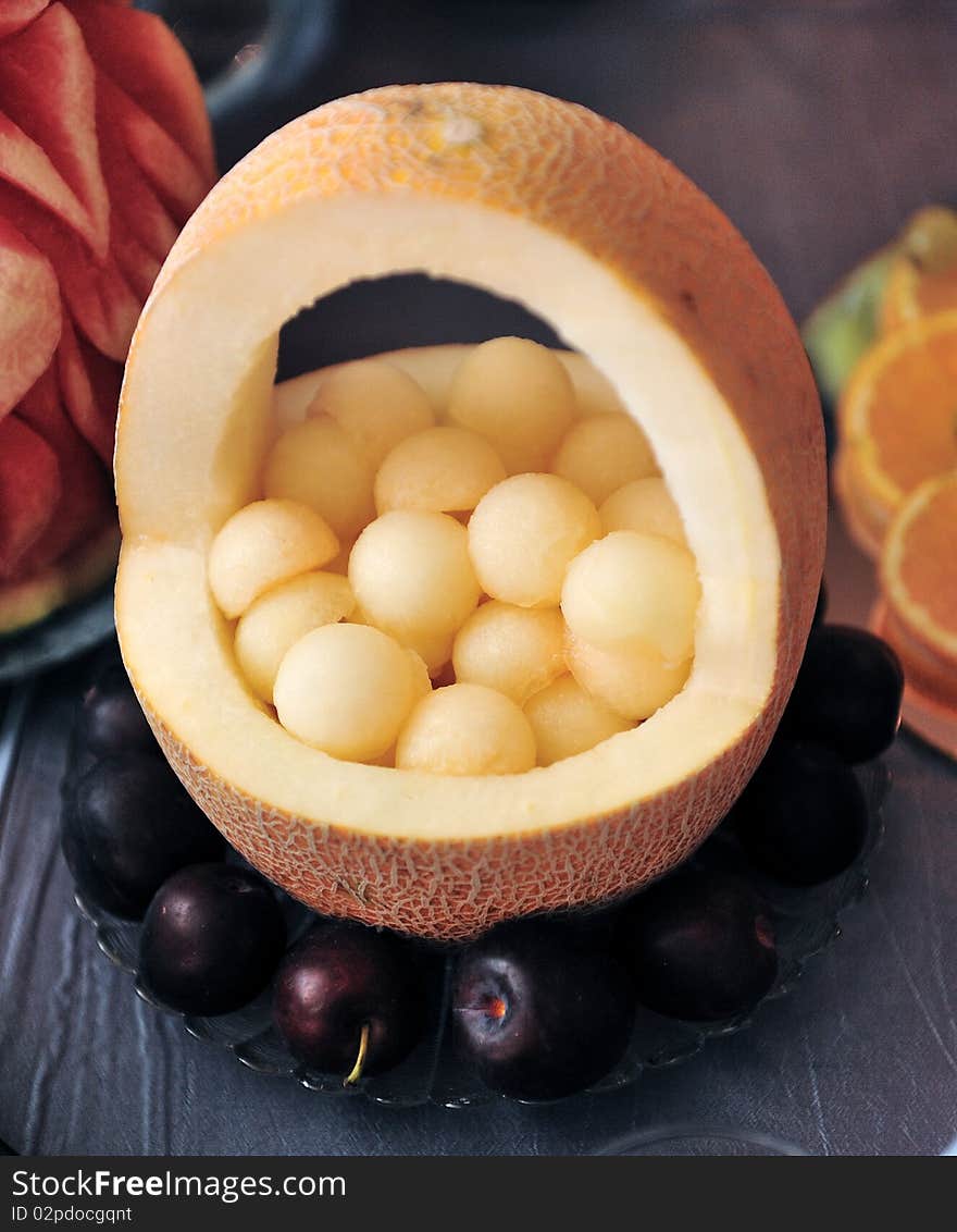 Fruit plate with bananas,kiwis, pineapples, apples, grapes