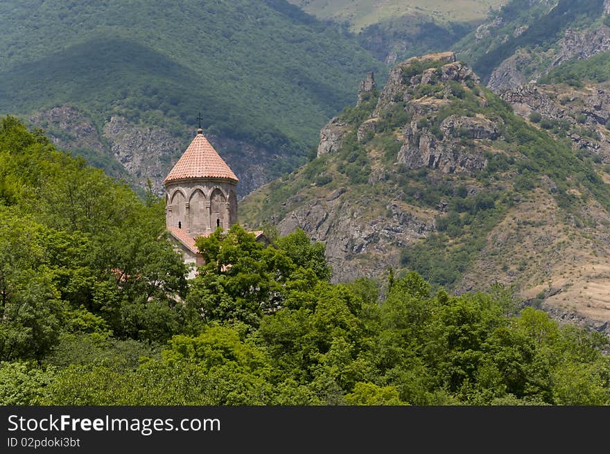 Old medieval church high in mountains and forest