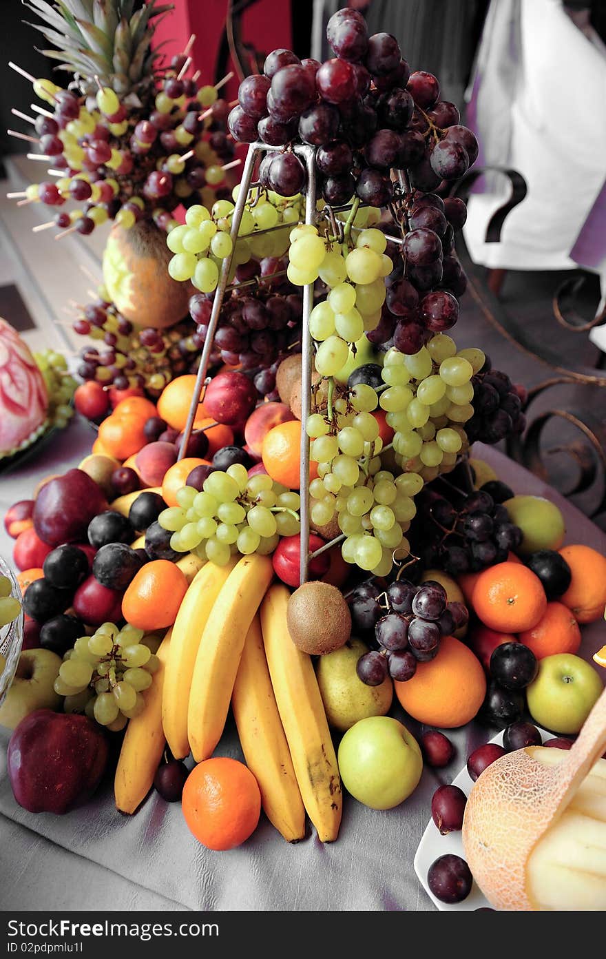 Fruit plate with bananas,kiwis, pineapples, apples, grapes