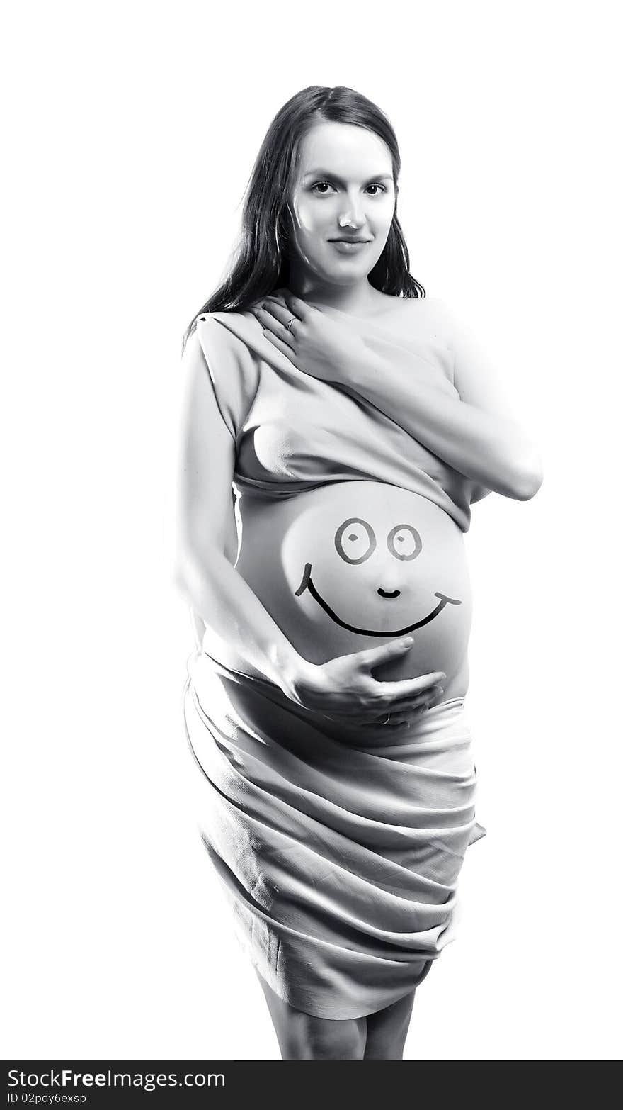 Pregnant woman with smile on her stomach