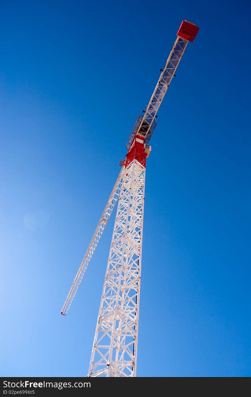 Tall white tower crane