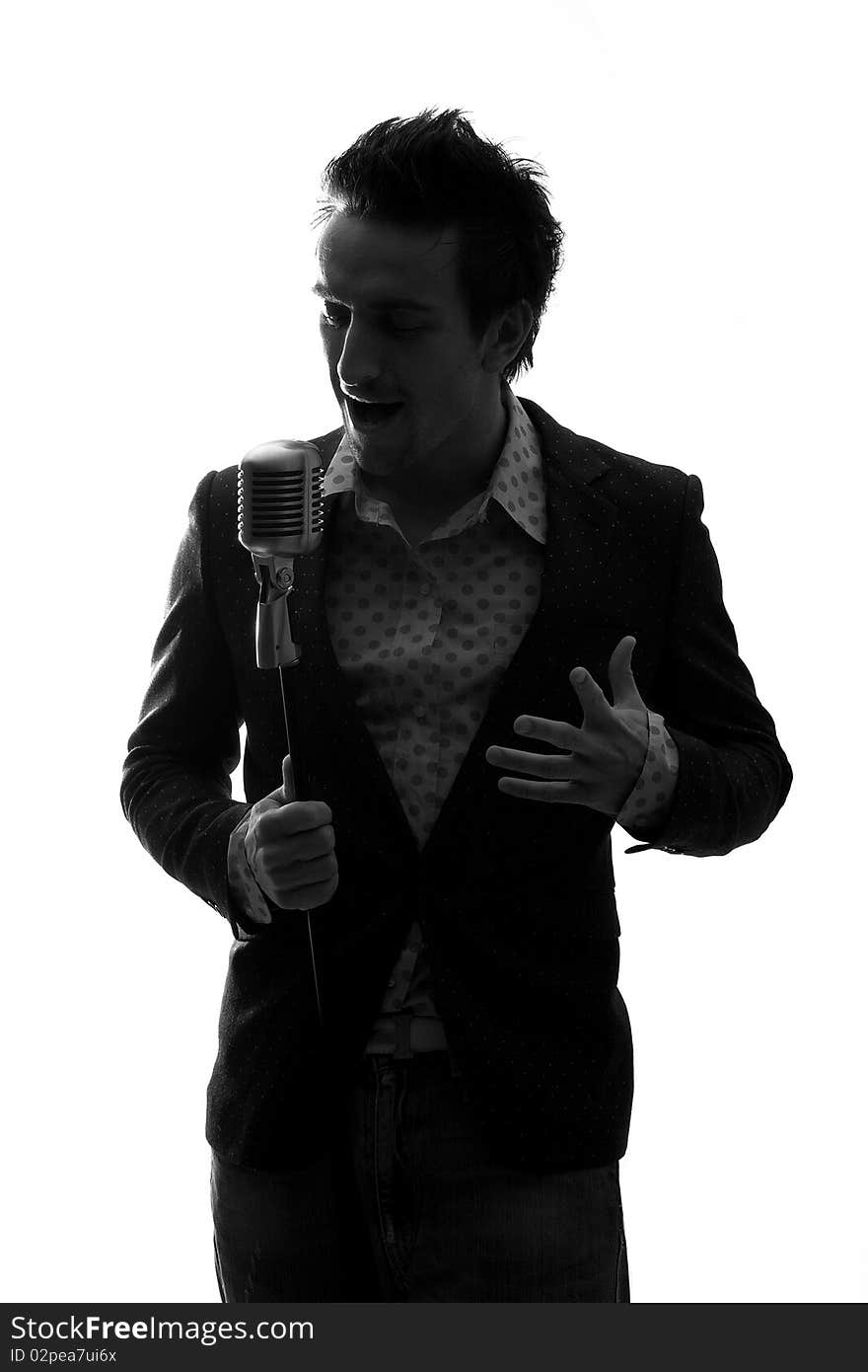 Man posing and singing in studio. Man posing and singing in studio