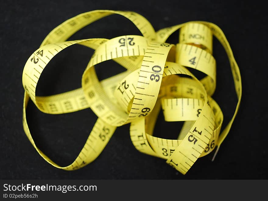 A tape measure or measuring tape, a flexible form of ruler, for use to measure one's body, use at home or by tailor and health instructor. A tape measure or measuring tape, a flexible form of ruler, for use to measure one's body, use at home or by tailor and health instructor.