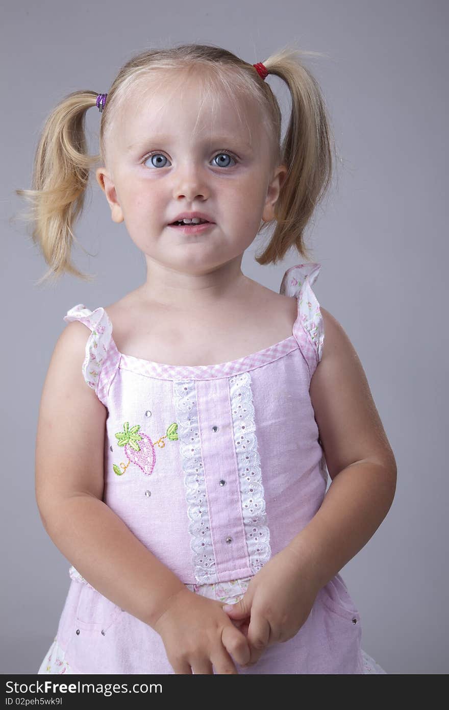 Beautiful little girl portrait with big blue eyes