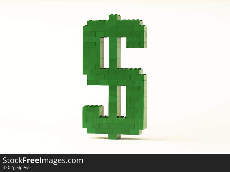 A green Dollar symbol constructed from toy bricks and shot against a white background at an angle to show it's 3D nature. A green Dollar symbol constructed from toy bricks and shot against a white background at an angle to show it's 3D nature.