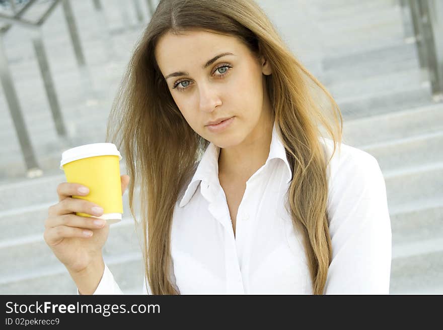 Young successful businesswoman having a coffebreak. Young successful businesswoman having a coffebreak