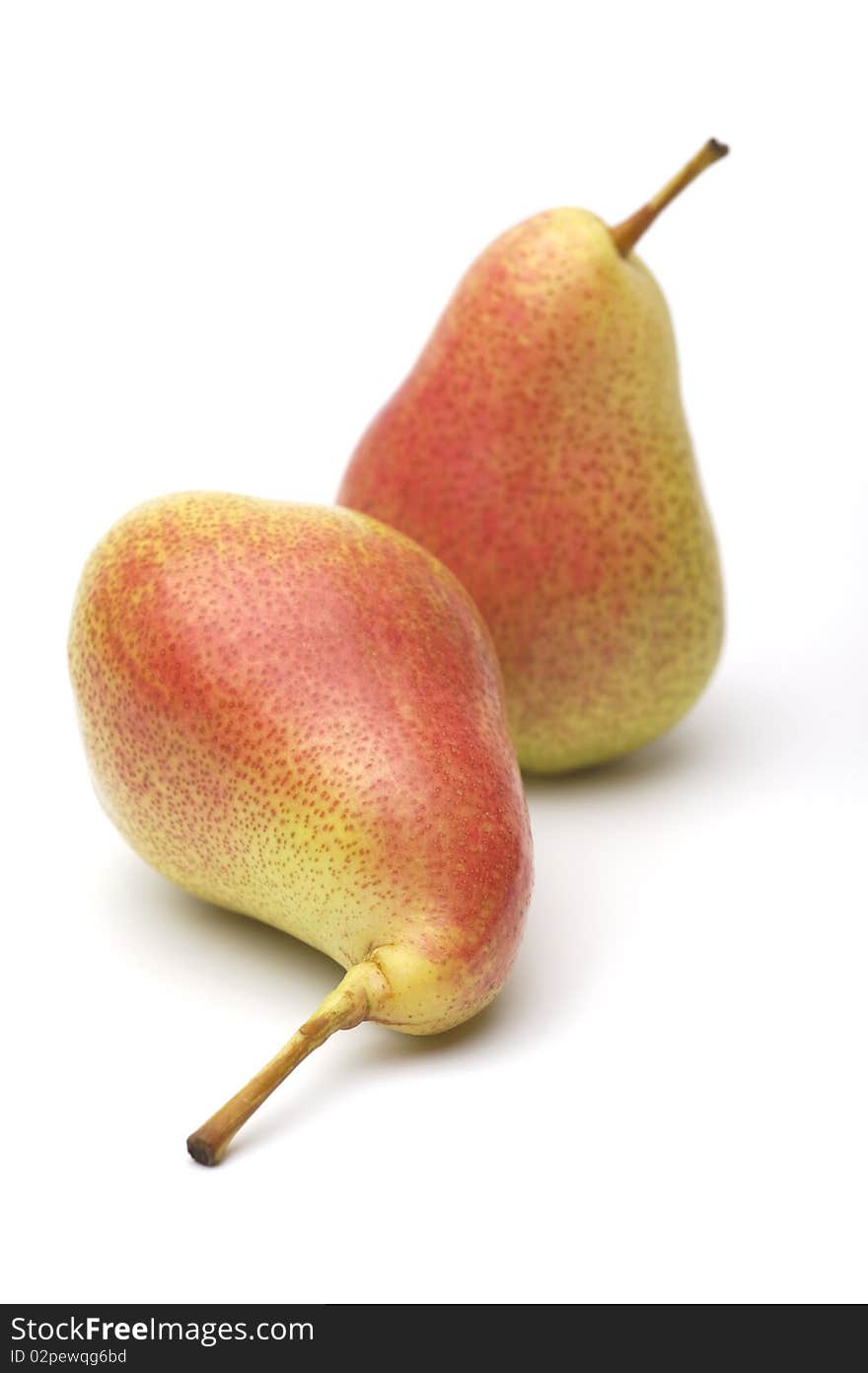 Two ripe yellow-red pears