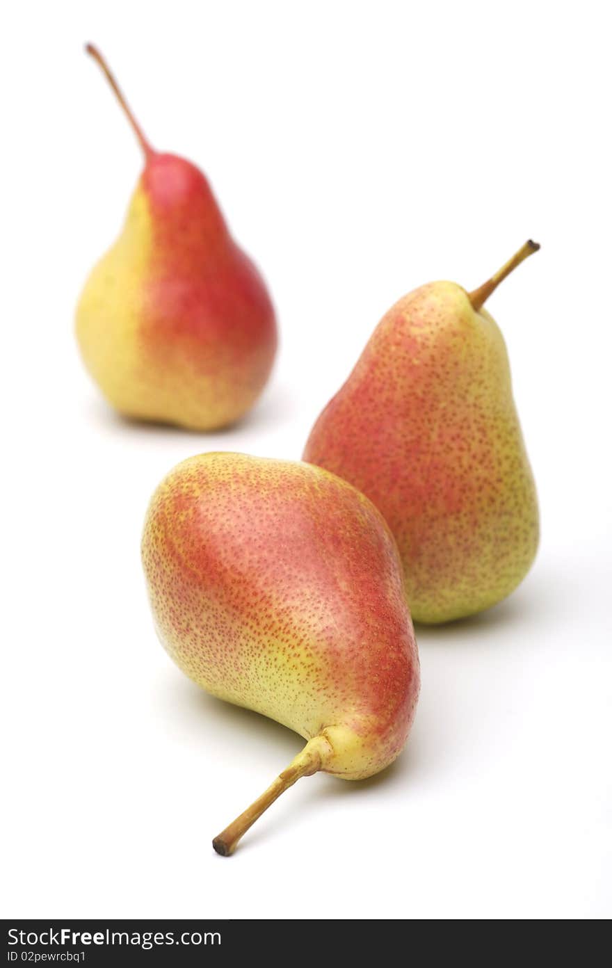 Three ripe yellow-red pears