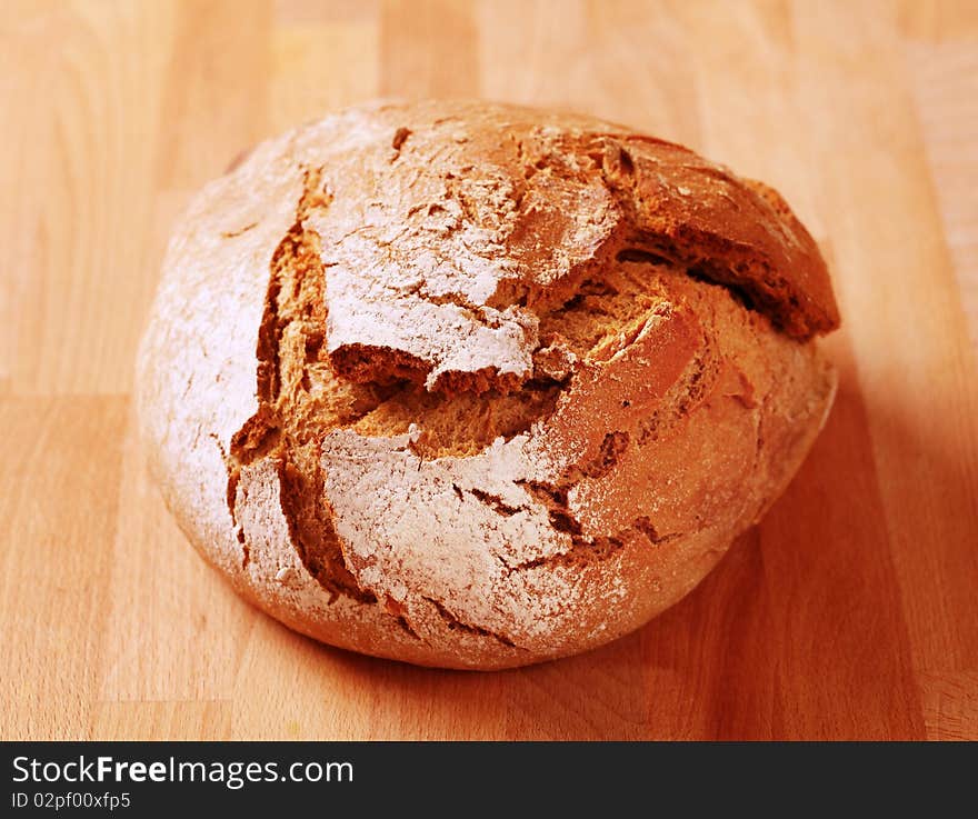 Loaf of fresh crusty bread - closeup. Loaf of fresh crusty bread - closeup