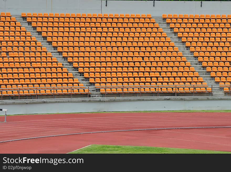 Empty orange seat in stadium