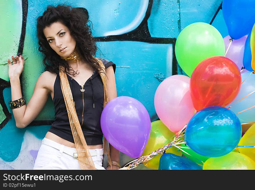 Happy woman with colorful balloons