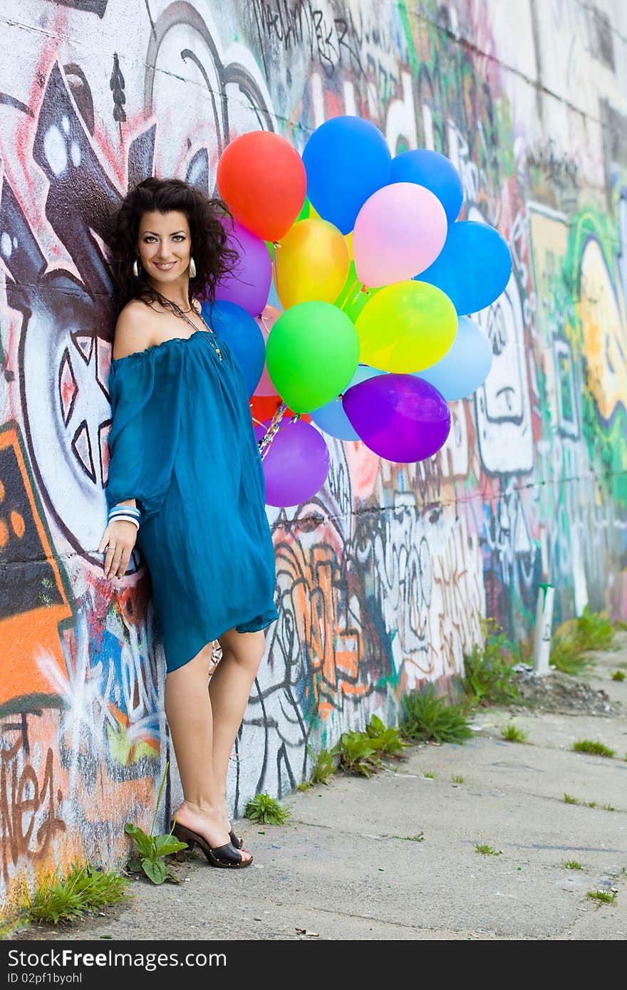 Happy woman with colorful balloons