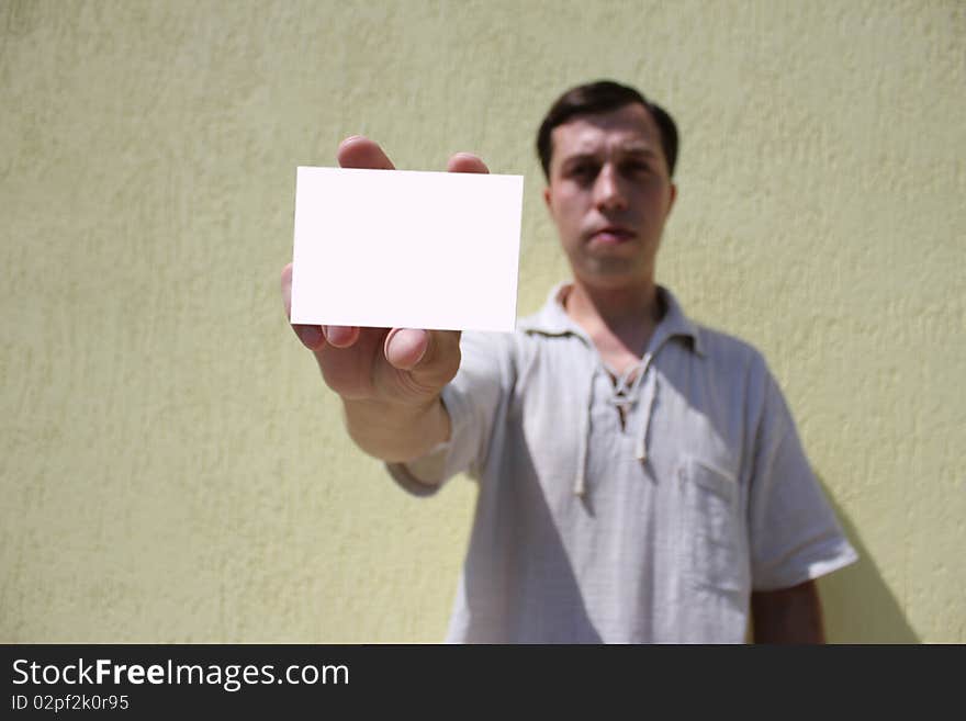 White card in a man's hand