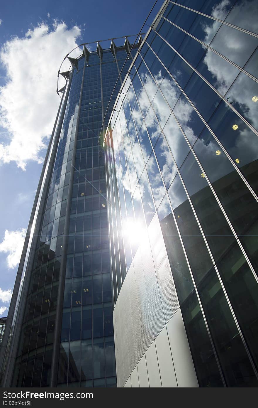 Sunlight gleaming off modern offices in London's financial district. Sunlight gleaming off modern offices in London's financial district