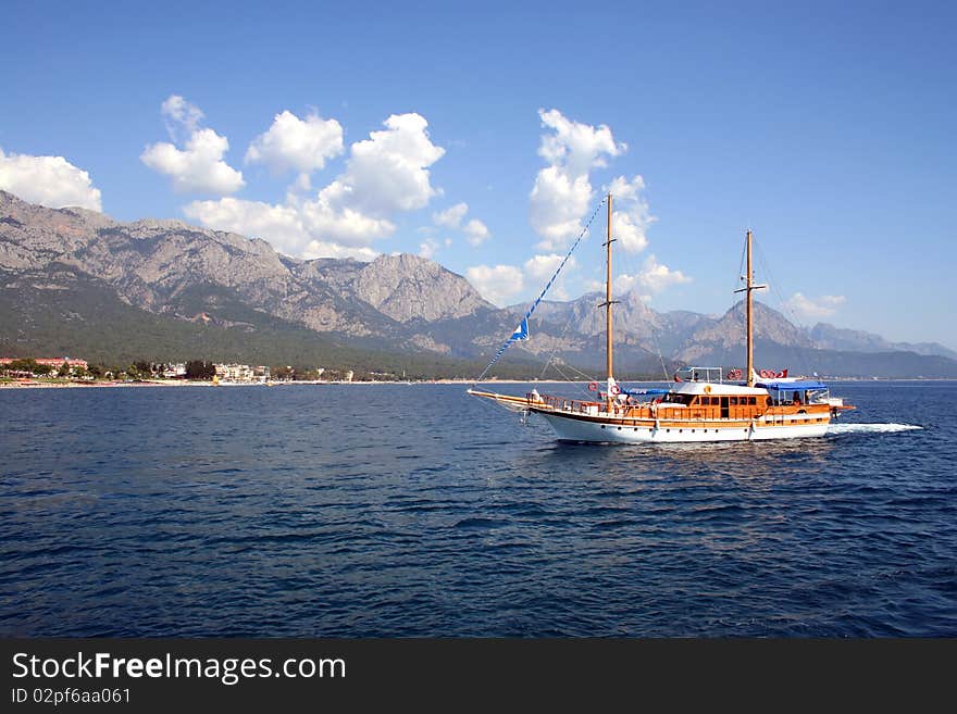 Yacht on the background of the shore