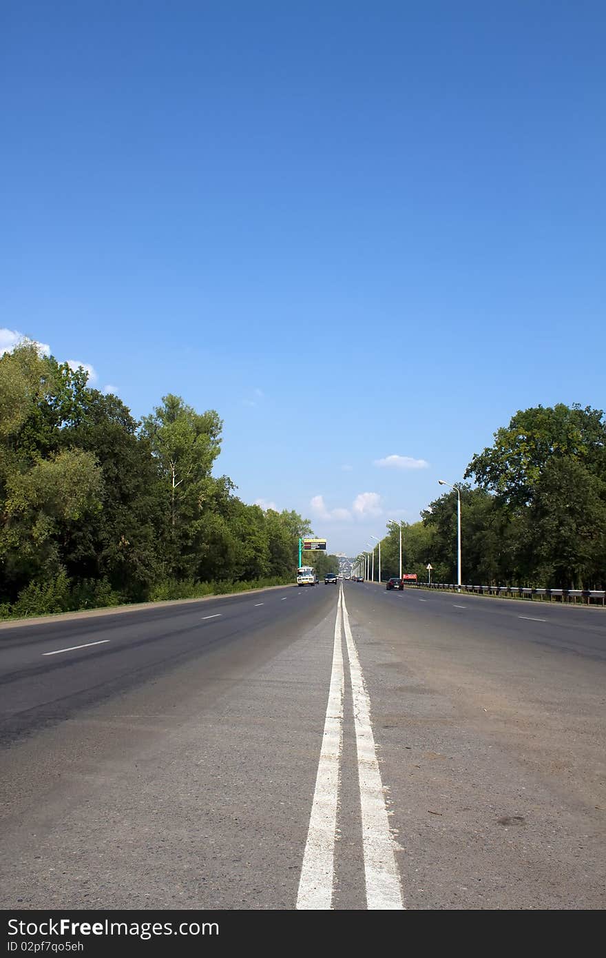 Road  asphalt  firm   covering  with a white dividing double strip