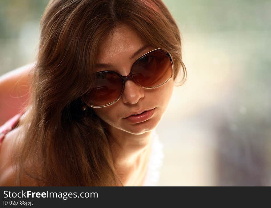 Portrait of young woman with sunglasses