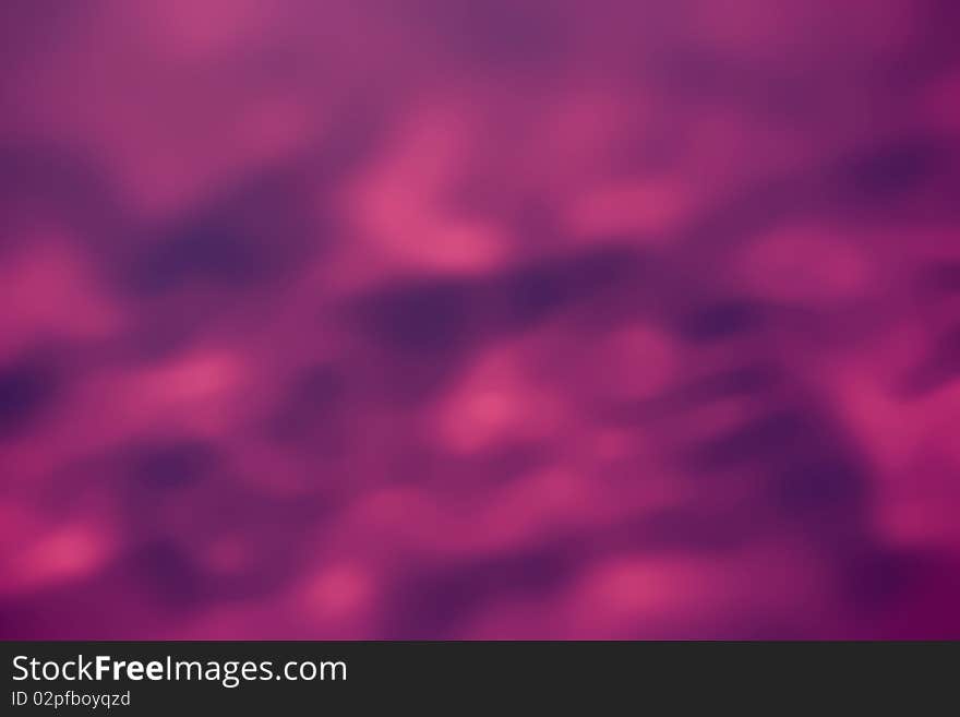 A dark pink and mauve blured background. A dark pink and mauve blured background