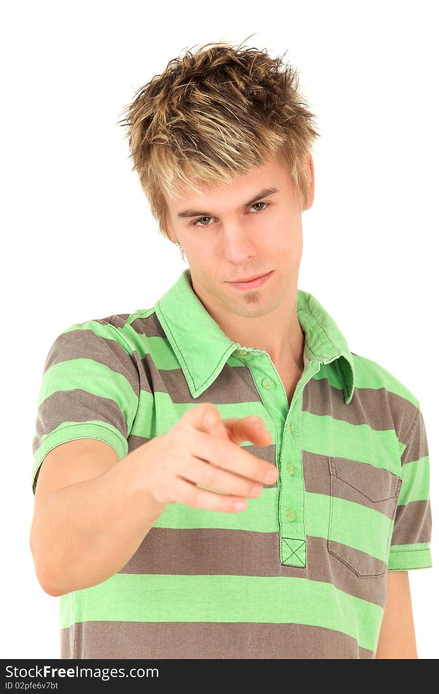 Portrait of teenage boy in striped green shirt pointing at camera, studio shot. Portrait of teenage boy in striped green shirt pointing at camera, studio shot