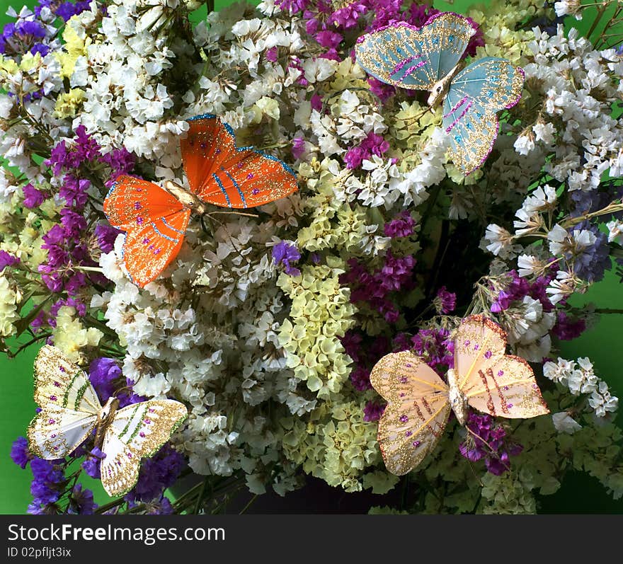 Decorative colourful butterflies on flowers. Decorative colourful butterflies on flowers