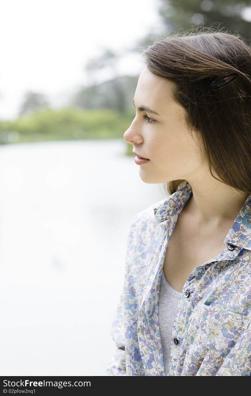 Profile of a Pretty Teenage Girl in a Park