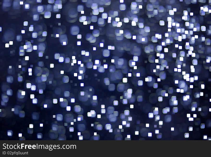 Illuminated white squares against dark blue purple. Illuminated white squares against dark blue purple.