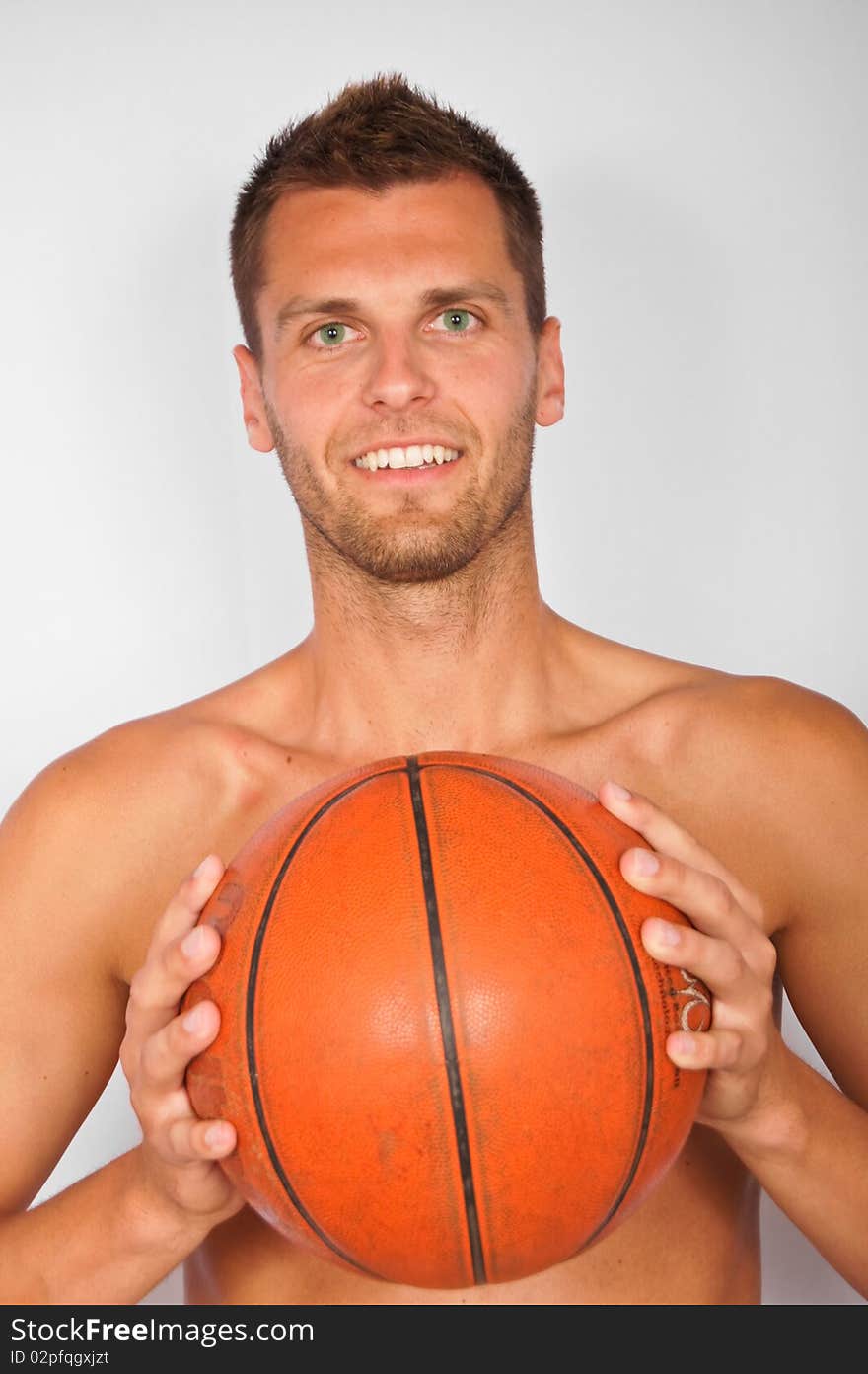 Young smiling man with basketball ball. Young smiling man with basketball ball