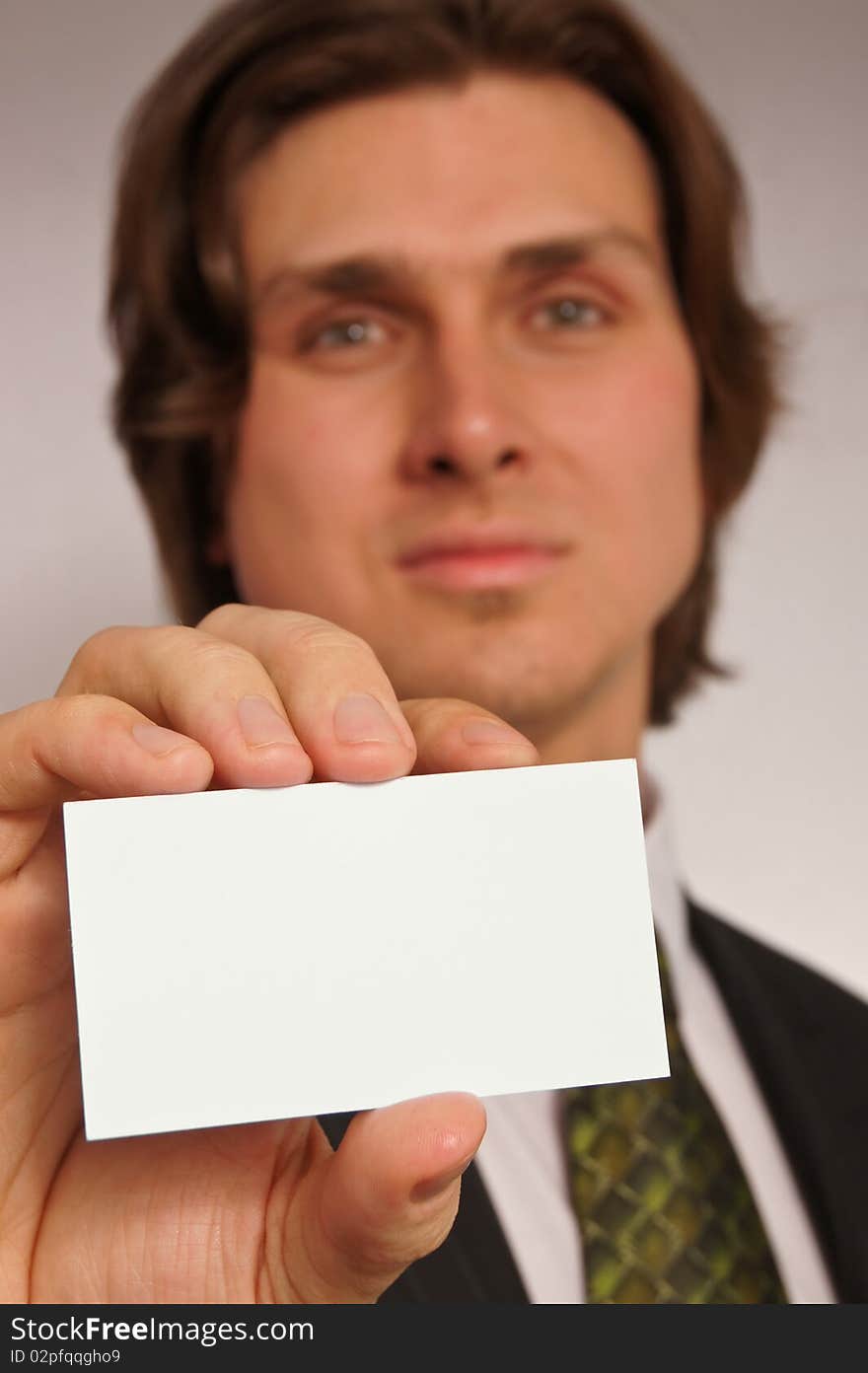 Young man with business card