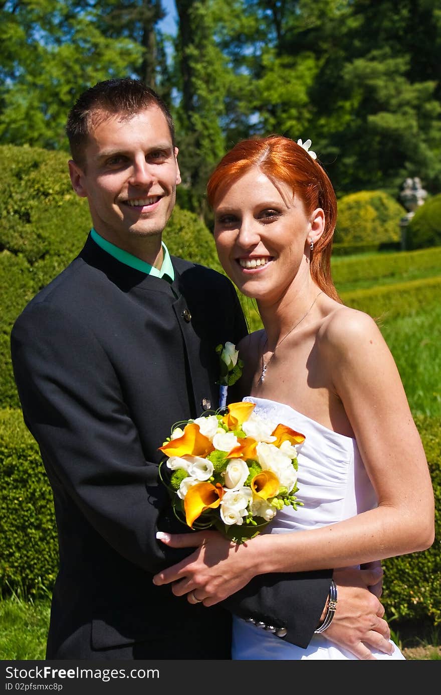 Young bride and groom in the garden